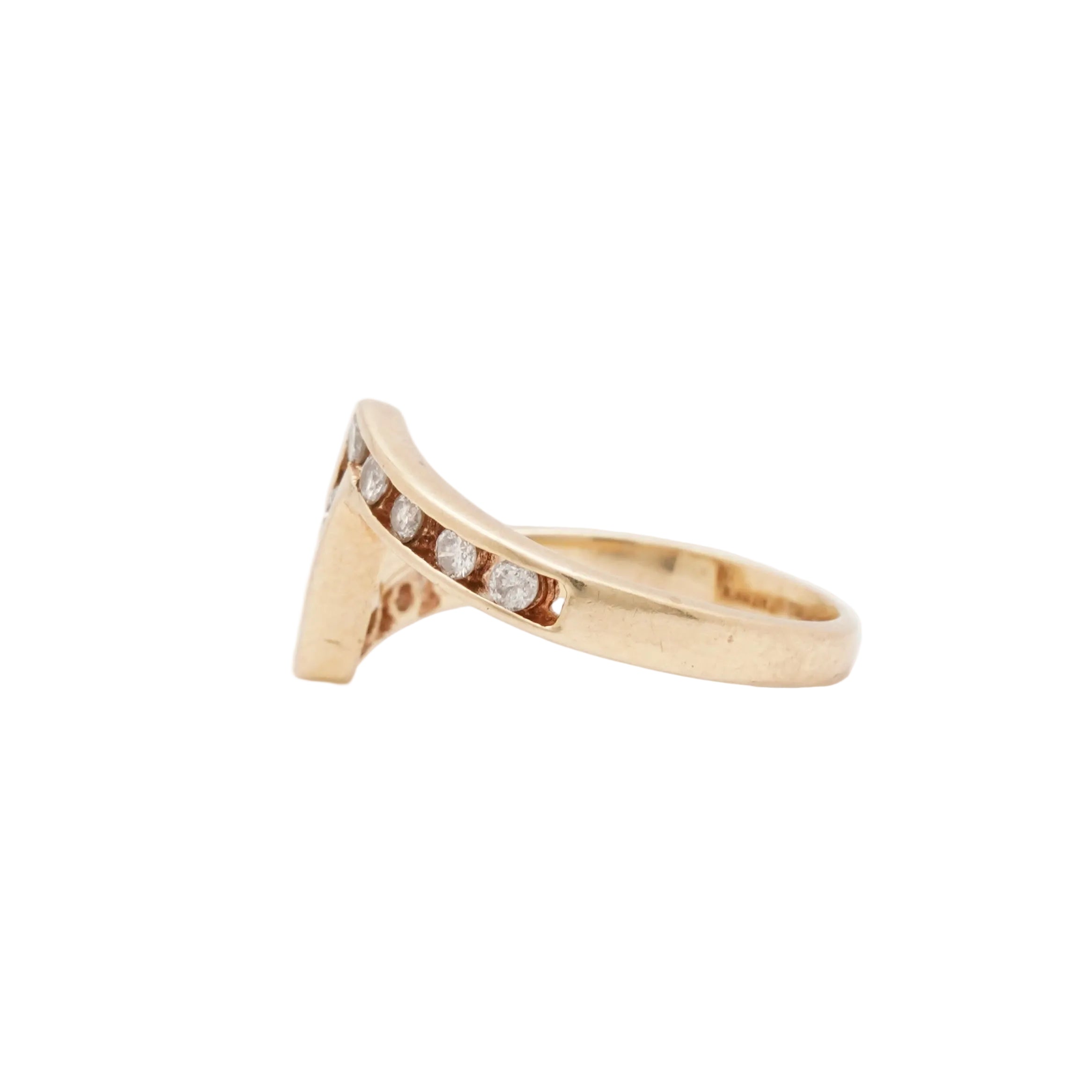 Gold ring with small diamonds on a light background