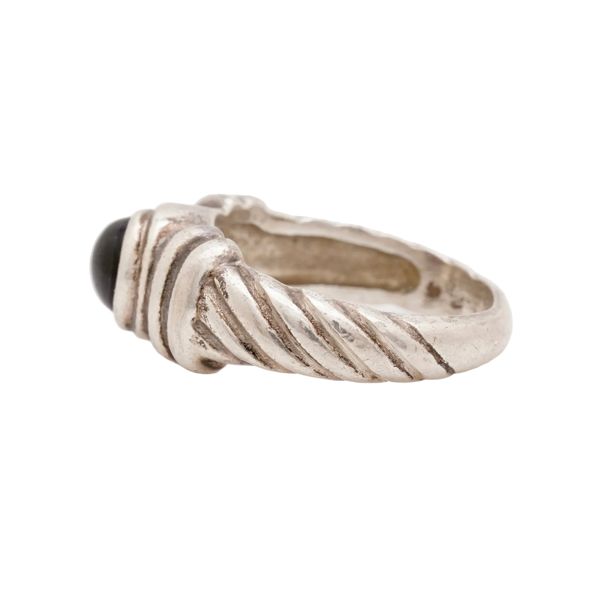 Side view of a vintage 925 sterling silver twisted rope ring highlighting the sculpted band and bezel-set red garnet cabochon. Size 6.5, 4.97 grams. Stamped 925.
