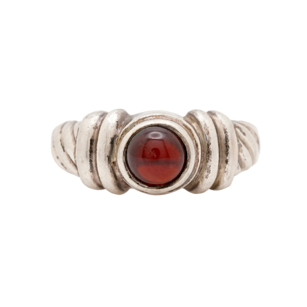 Front view of a vintage 925 sterling silver ring featuring a classic twisted rope design and a centered round red garnet cabochon. Size 6.5, weighs 4.97 grams. Stamped 925. Very good vintage condition.