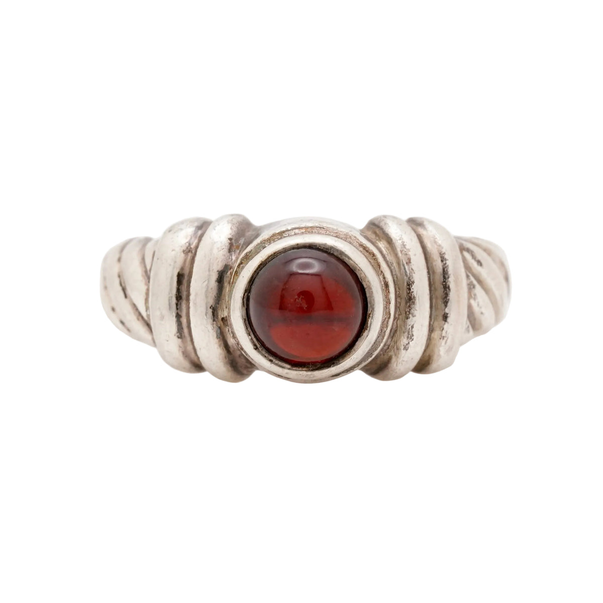 Front view of a vintage 925 sterling silver ring featuring a classic twisted rope design and a centered round red garnet cabochon. Size 6.5, weighs 4.97 grams. Stamped 925. Very good vintage condition.