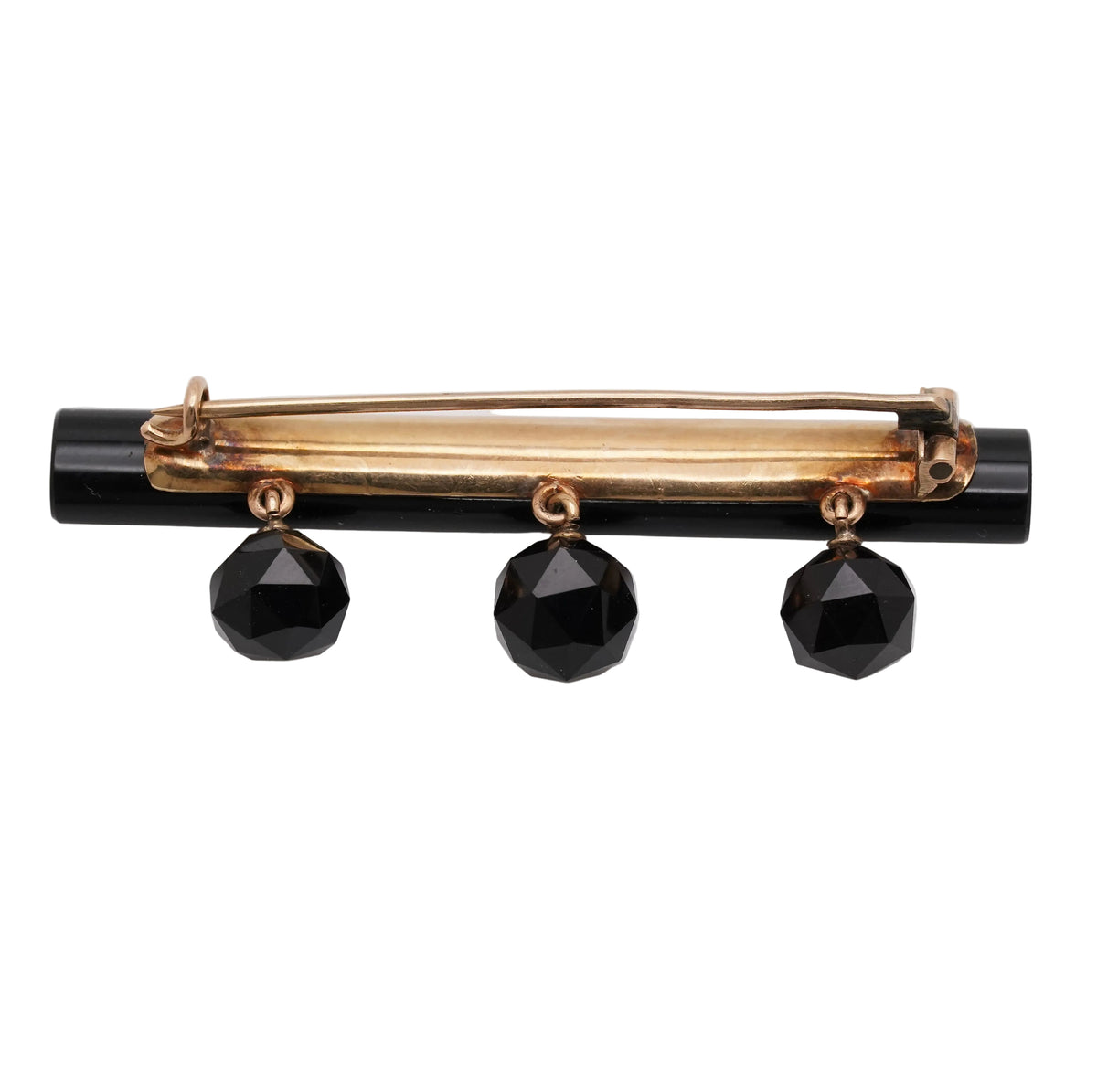 Back of antique black onyx mourning bar brooch showing tube hinge, pin, and C-catch