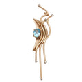 Estate modernist yellow gold pin with oval blue topaz and six small diamonds, front view