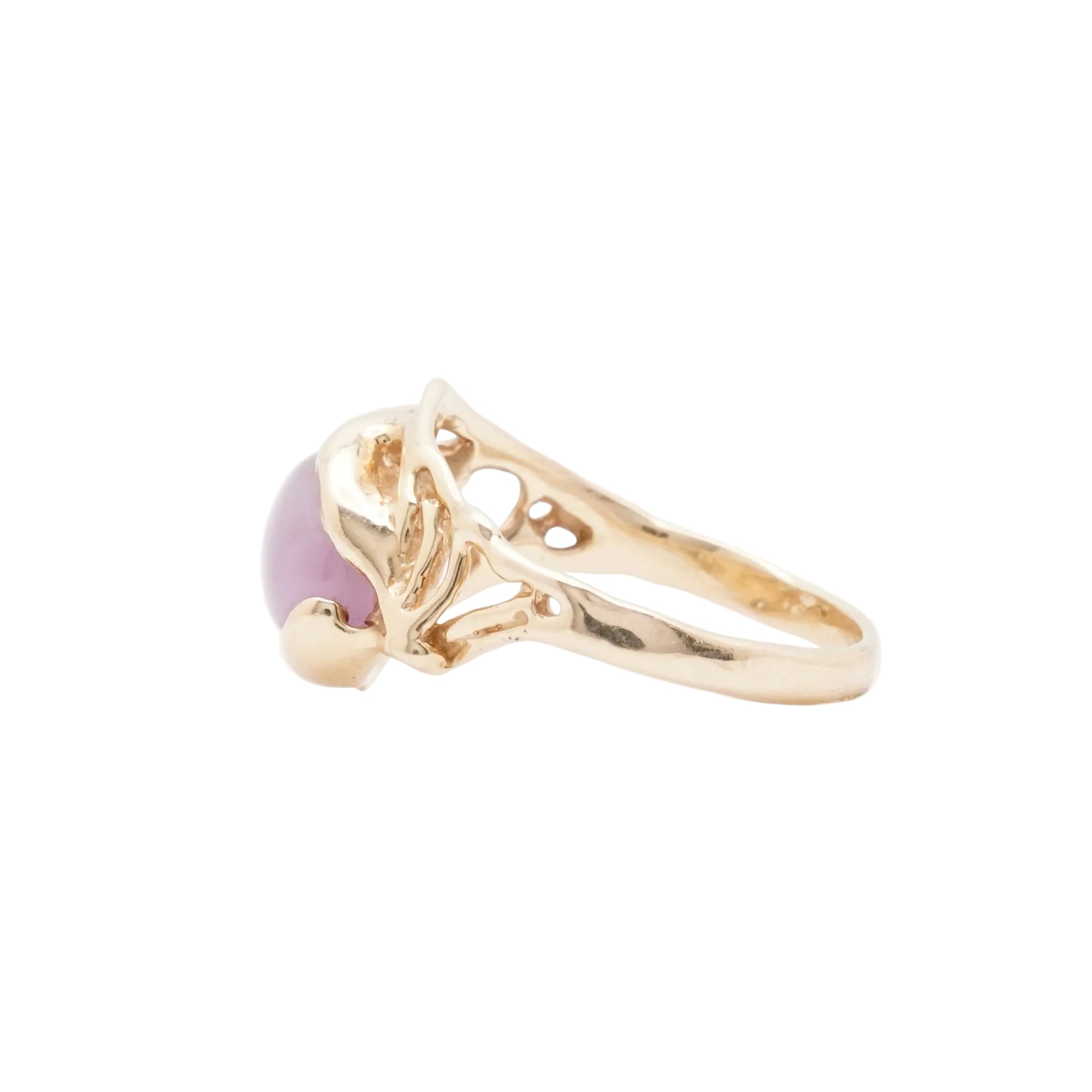 pink star sapphire in 14k yellow gold on white background side view