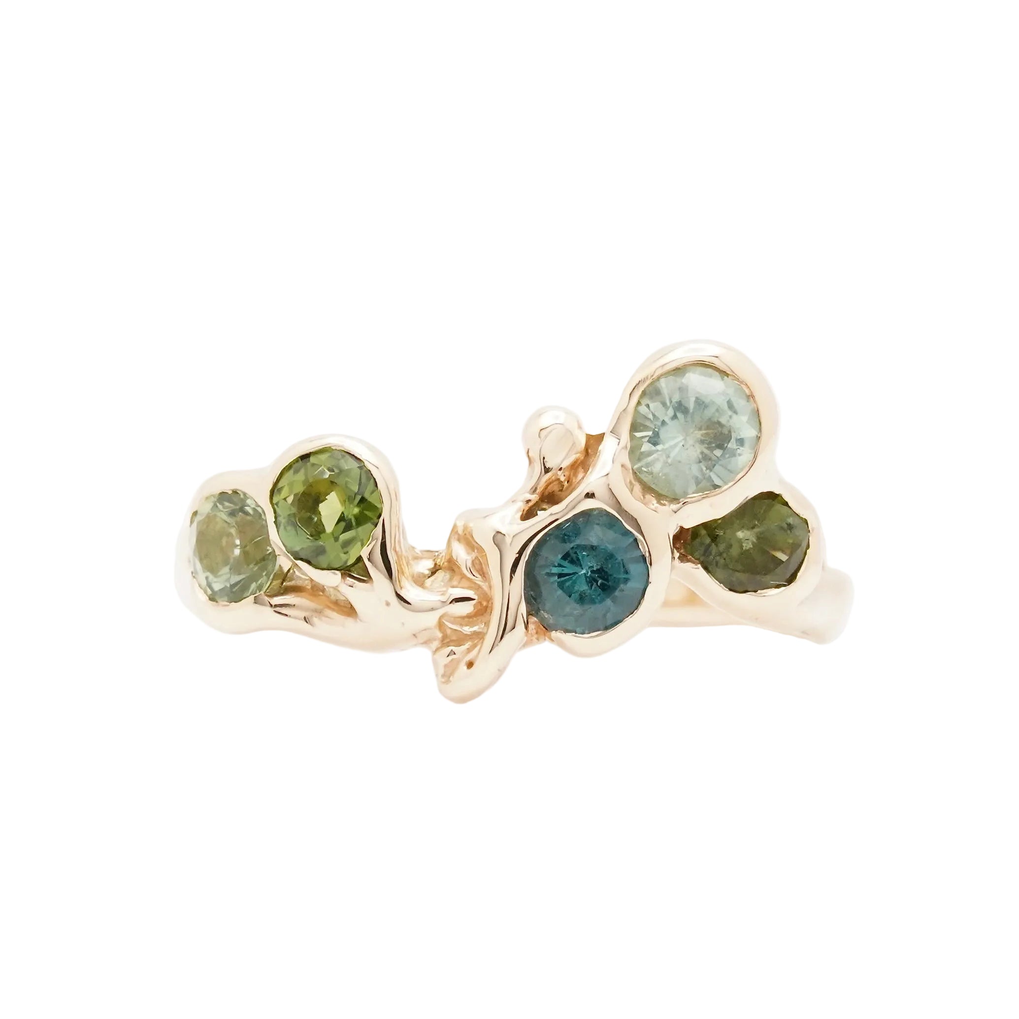 A delicate gold ring featuring five round-cut tourmalines in various shades of green, blue, and teal, arranged in a natural, branching cluster design on a clean white background.