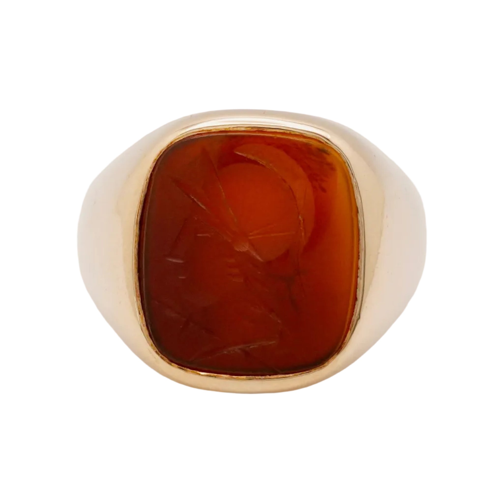 Gold ring with a brown stone on a light gray background