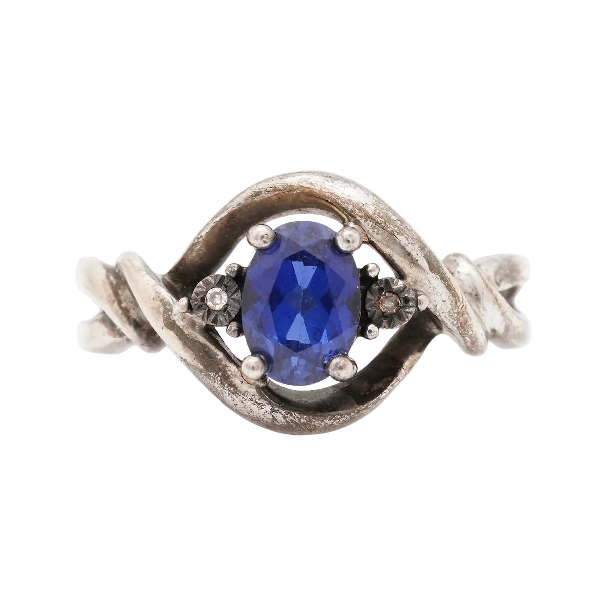 Vintage sterling silver ring with an oval synthetic sapphire and two natural diamond side stones, stamped 925
