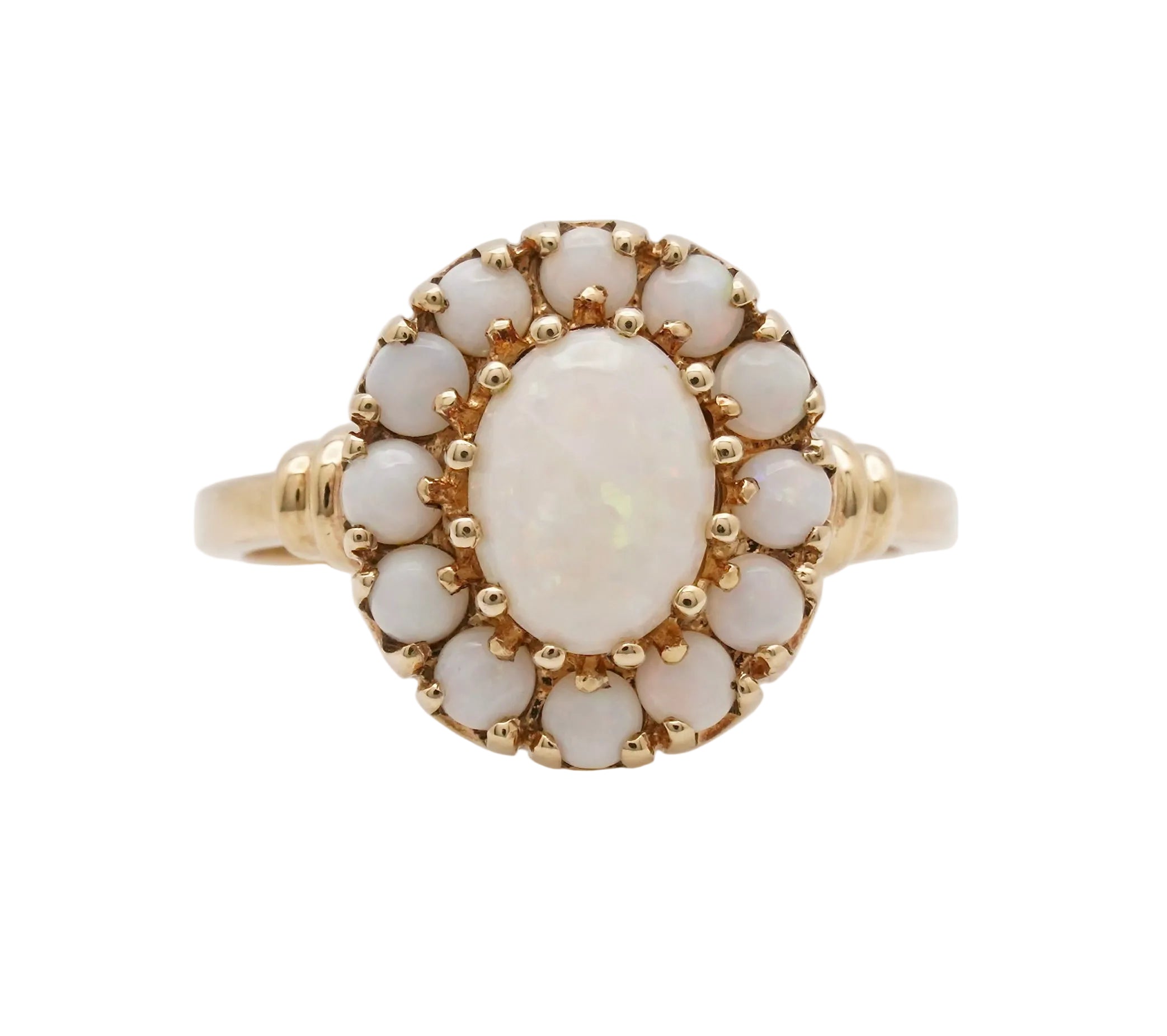 Gold ring with a central opal stone on a white background